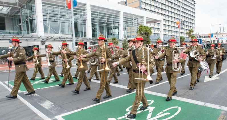 Military band marching down street